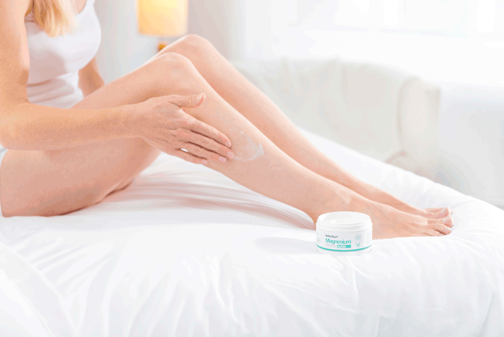 Picture of woman rubbing magnesium cream onto her leg