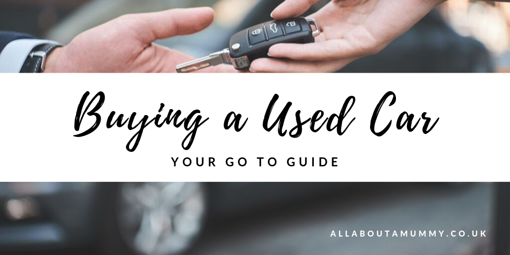 Picture of car keys being exchanged with blog post title ' Buying a used car: Your go to guide'