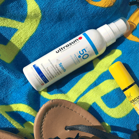 Picture of Ultrasun sun care spray on towel