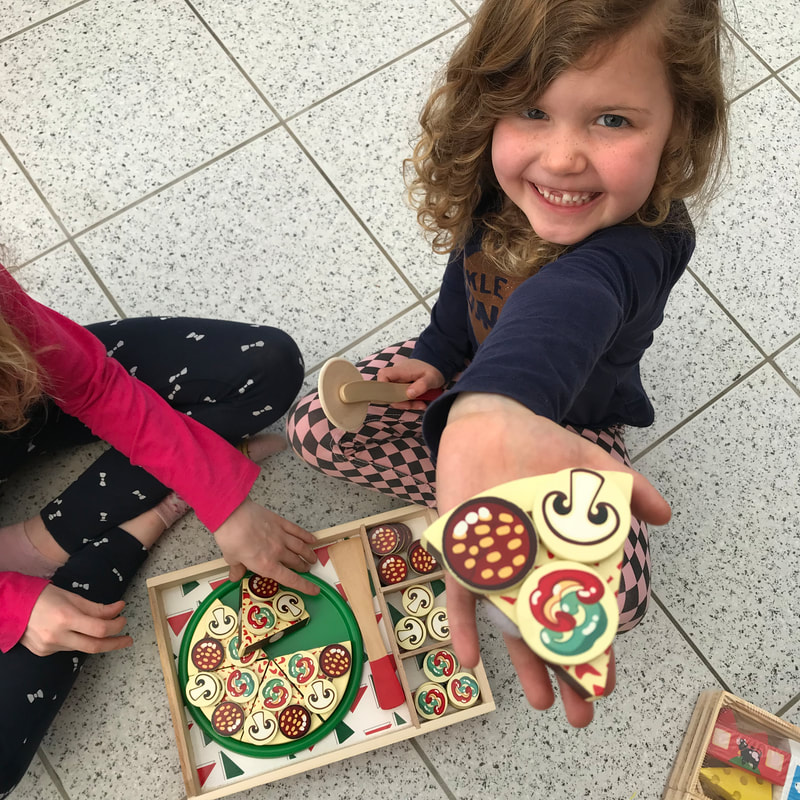 Picture of Melissa and Doug wooden pizza toy in use
