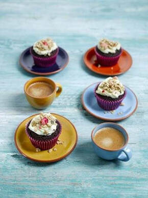 Chocolate Beetroot Cupcakes recipe - cupcakes on plates with cups of tea and coffee on blue background