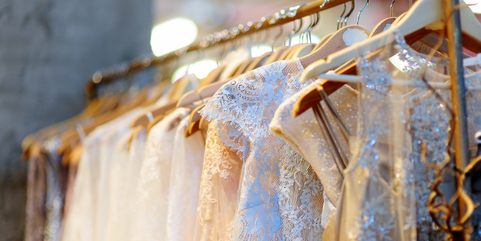 Picture of wedding dresses hanging on a rail