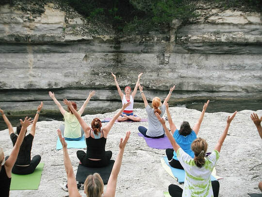 Picture of a yoga class in a canyon