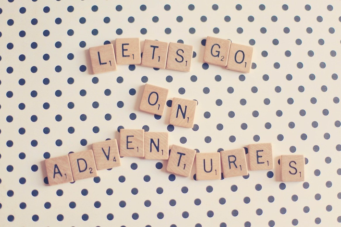 Picture of scrabble tiles spelling 'Lets go on adventures'